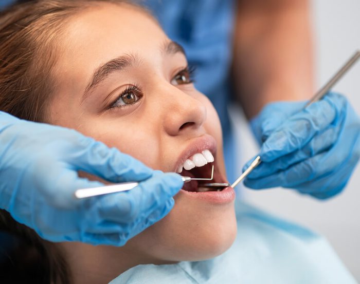 Preventive dental care exam at Karsch Family Dental in Farmington, MO. young girl being examined.