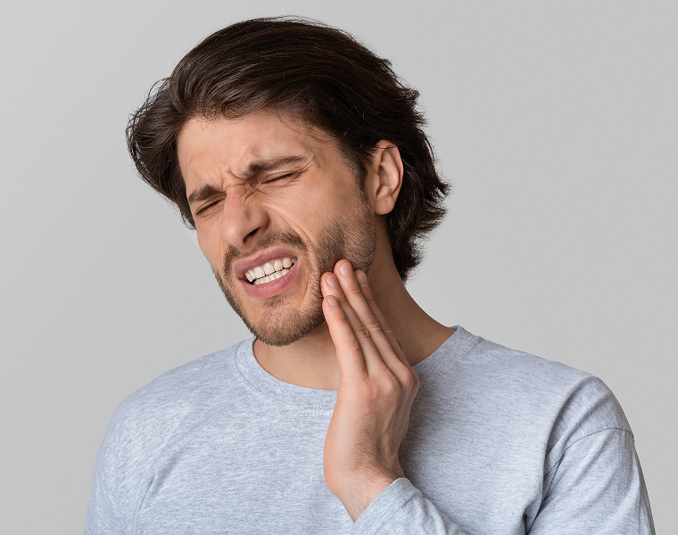 man with jaw pain