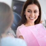woman in dental chair at dentist, first preventive dental visit