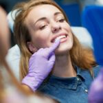 woman in dental chair getting cosmetic dental treatment