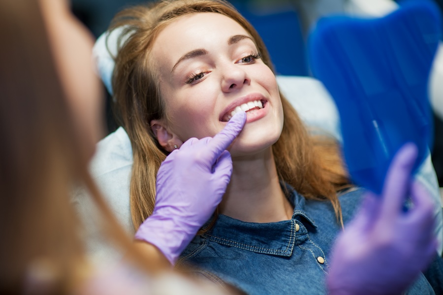 woman in dental chair getting cosmetic dental treatment