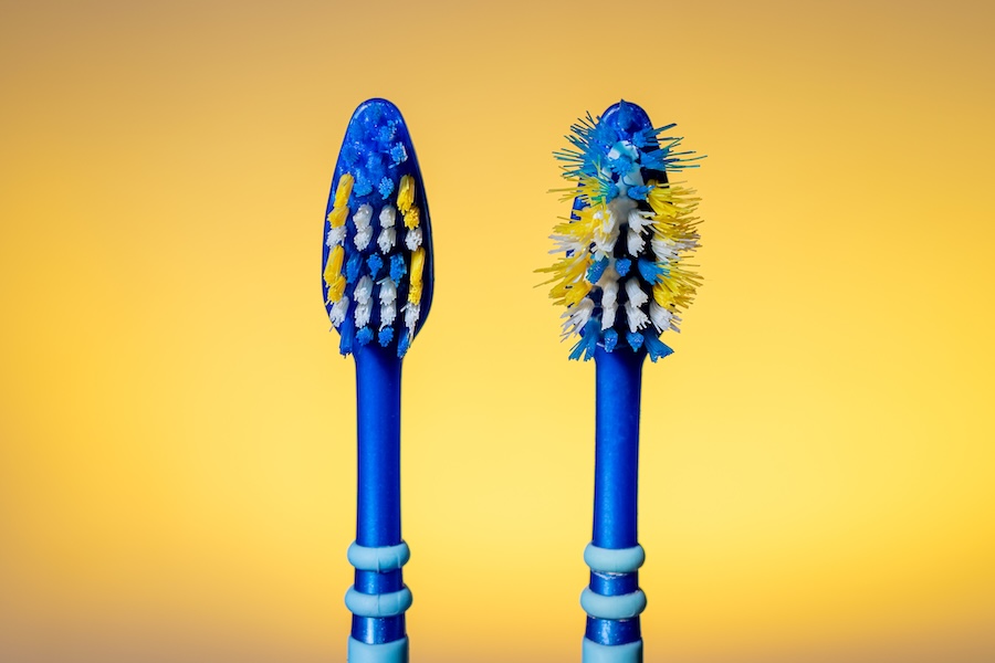 worn out toothbrush bristles, bad dental habits, aggressive brushing